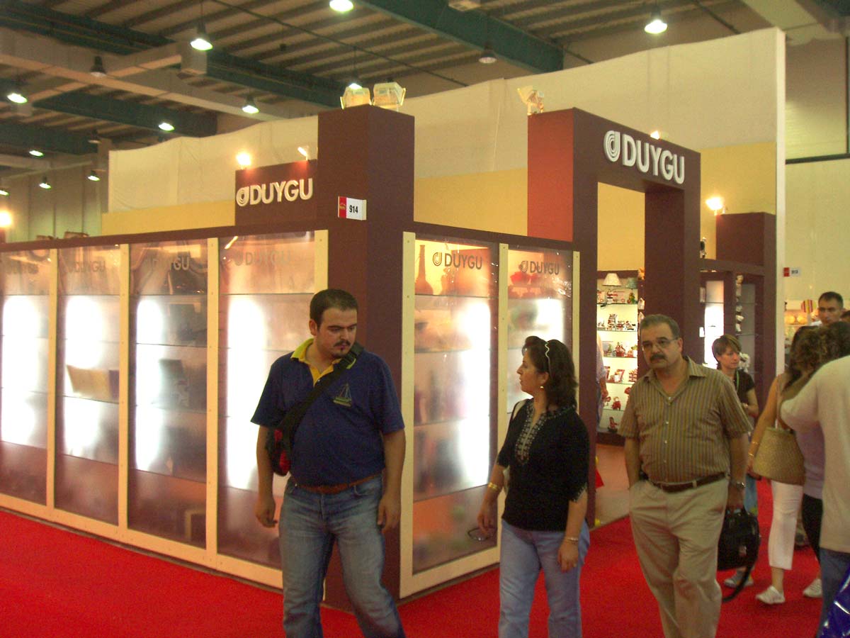 People walking in front of the Duygu Exhibition Booth