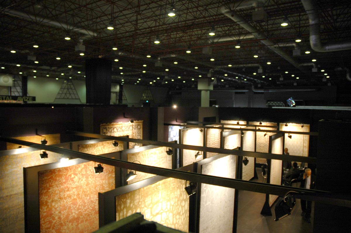Rugs displayed in large Black Expo Stand showroom