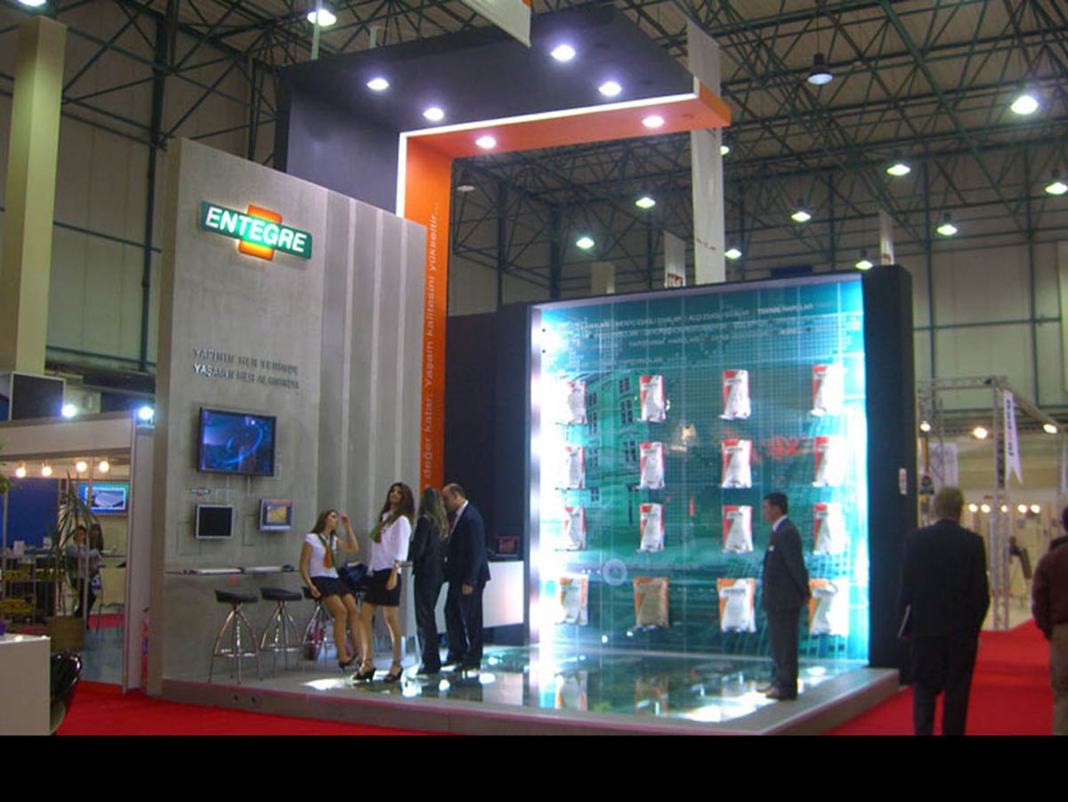 People walking on Custom Exhibition Stand glass windows
