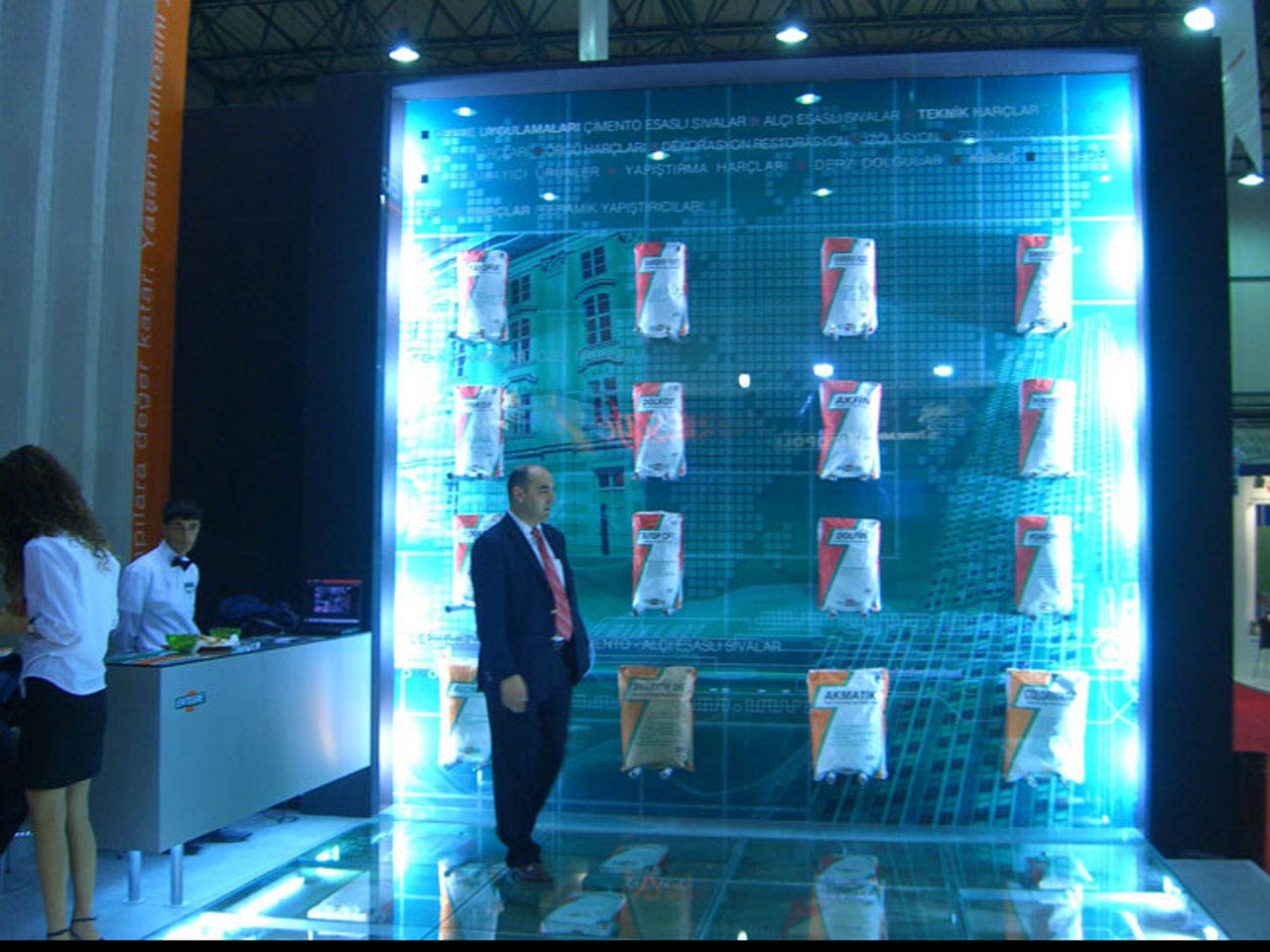 Blue Exhibition booth products inside glass made wall lit by LED lights