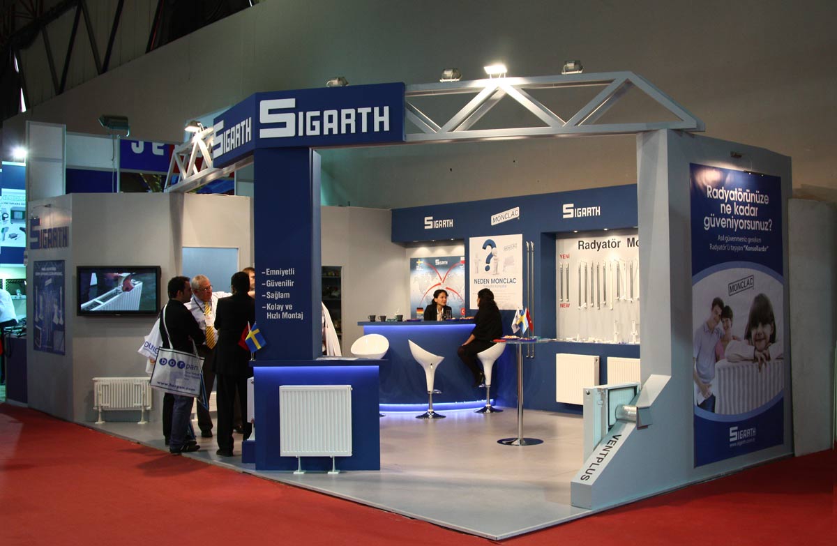 Medium size Custom Exhibition Stand in blue and silver colour with a number of people talking inside it.