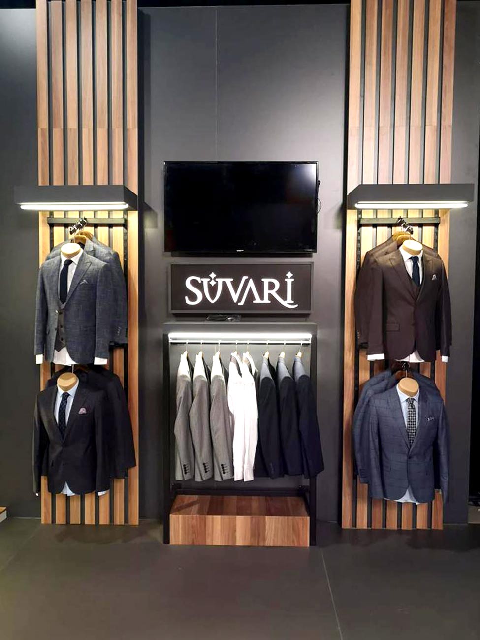 Suits on a wooden designed wall in an Exhibition Stand