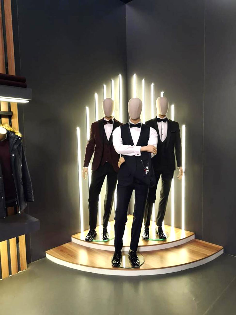 Stylish mannequin in Suvari suits displayed at a trade show