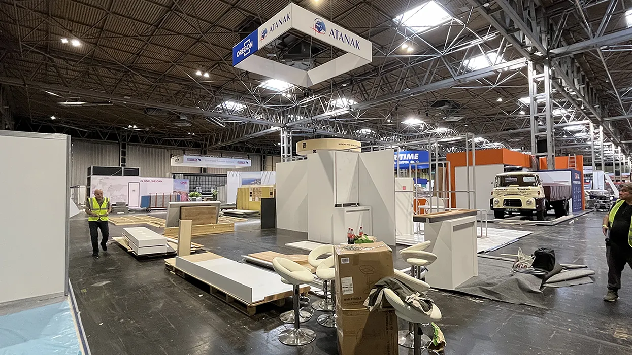 Exhibition Stand construction with a company banner hung from the ceiling