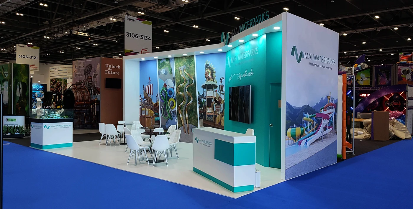 Modern turquoise Exhibition stand featuring a seating area and a desk